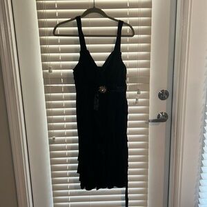 Little black dress that cuts middle of thigh. Great for the holidays.